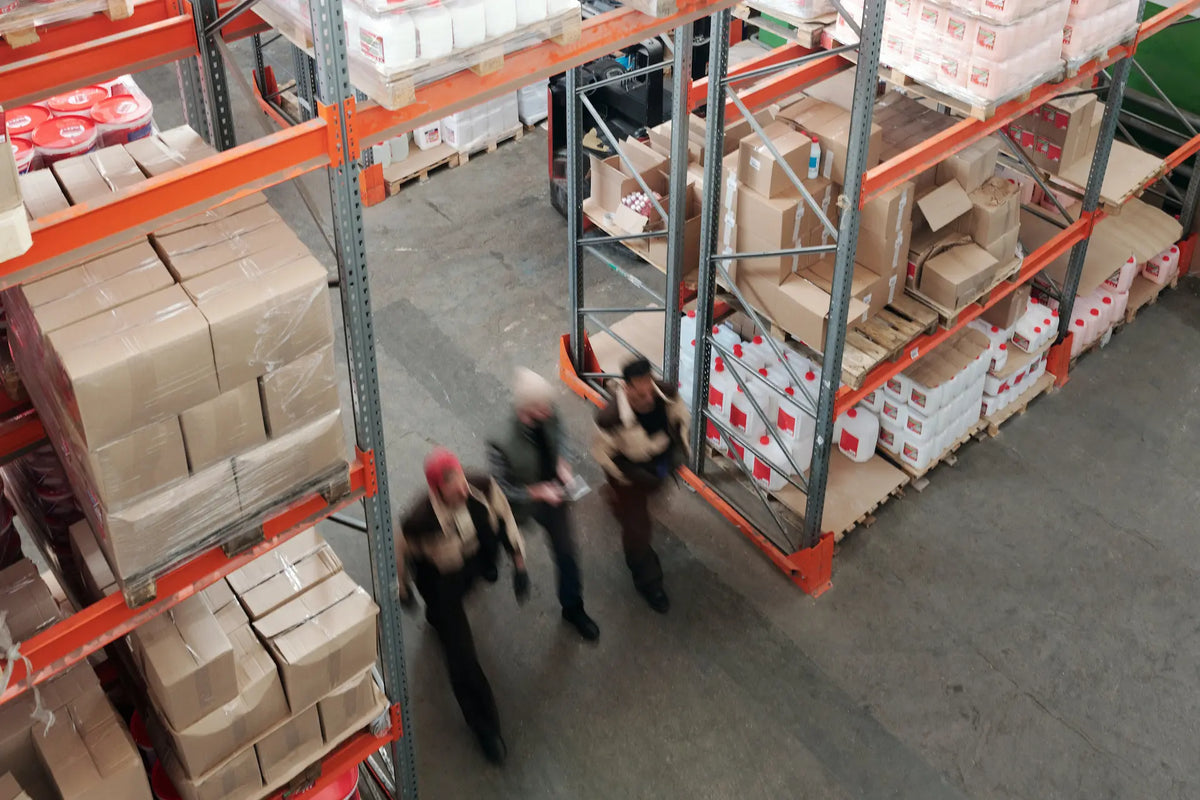 Warehouse shelves stacked with boxes of supplies